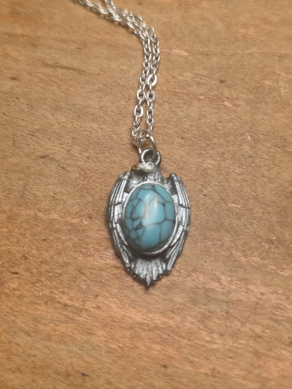 Silver Bird Pendant With Turqoise Gemstone Belly On A Silver Tone Chain Necklace